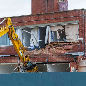 demolition-equipment-dismantling-a-brick-building-2026-09-21-06-28-41-utc